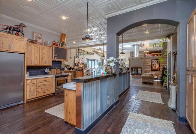 The kitchen and bar, looking through the archway toward the front room
